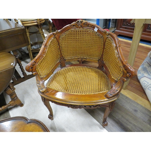 1071 - Nicely Carved Vintage Bergere tub chair together with a small vintage circular table. See photos.