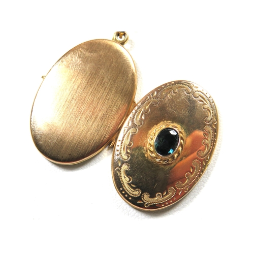 365 - 9ct Gold Locket set with a central Oval Sapphire attached to a 24 inch 9ct Yellow gold Chain.  Total... 