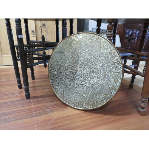 1087 - Pair of Vintage Eastern  Brass topped tables with folding frames. See photos.