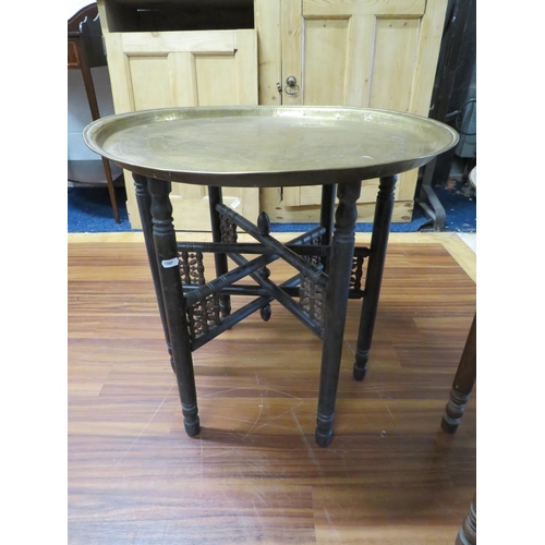 1087 - Pair of Vintage Eastern  Brass topped tables with folding frames. See photos.