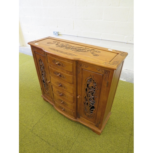 1115 - Ornate Cabinet with pierced doors, six drawers to centre console.. H:34 x W:37 x D:14 inches. See ph... 