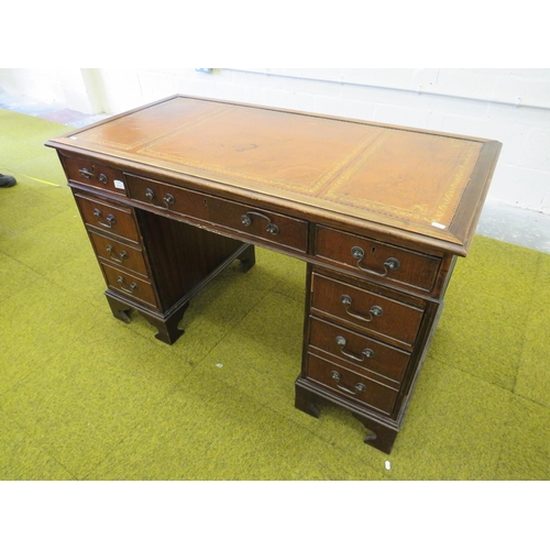 1116 - Leather topped Kneehole pedestal desk in good order. H:30 x W:48 x D:24 inches. See photos.