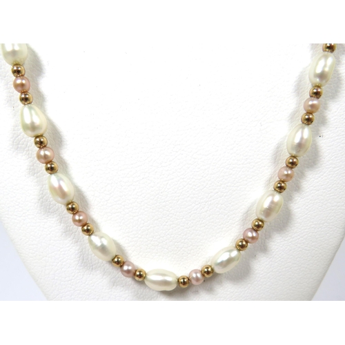 516 - Pretty Natural Pearl Necklace with 9ct Clasp  16 inches long. See photos.