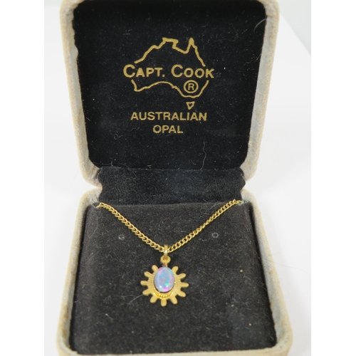 517 - Australian Opal set pendant with Yellow metal mount and 16 inch Yellow Metal Chain with Captian Cook... 