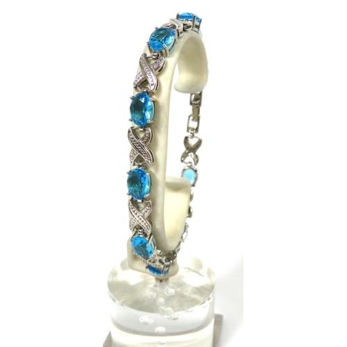 521 - 925 Silver Bracelet set with Deep Blue Coloured Gemstones.  8 inches with two adjusters fitted.  See... 