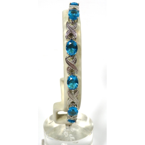 521 - 925 Silver Bracelet set with Deep Blue Coloured Gemstones.  8 inches with two adjusters fitted.  See... 