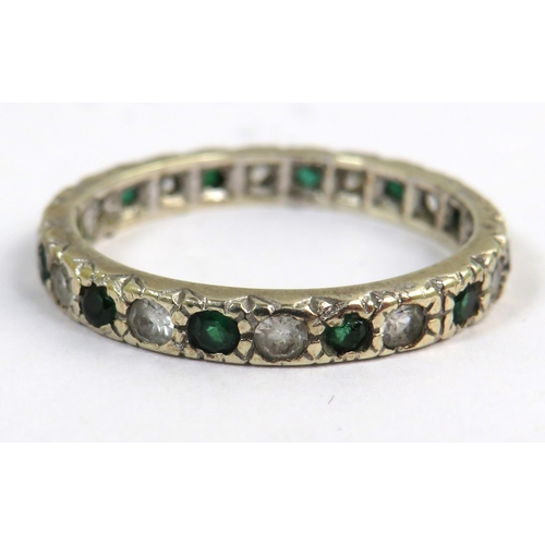 542 - 9ct White Gold Eternity ring set with Green and clear gemstones. Finger size 'N-5'   2.0g