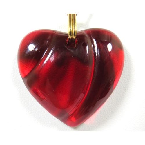 543 - Ruby Glass Heart Pendant by Baccarat hung on a 22 inch 9ct Yellow Gold Chain of approx 4g