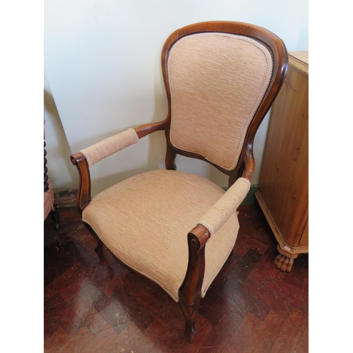 555 - Low Armchair with Mahogany frame. Nicely upholstered in Beige.  See photos.