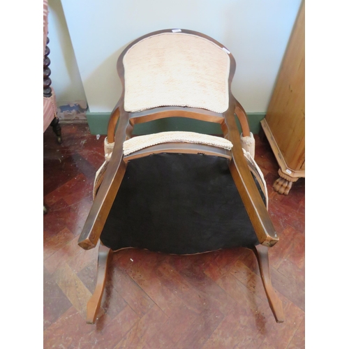 555 - Low Armchair with Mahogany frame. Nicely upholstered in Beige.  See photos.