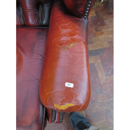 560 - Vintage Red Leather Chesterfield wing back chair in worn condition. Will need patches to arms. See p... 