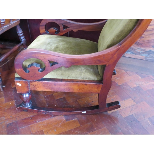 562 - Late 19th/Early 20th Century Upholstered Rocking chair with Mahogany Frame in good order. See photos... 