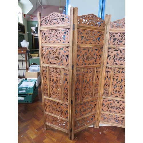 564 - Oak Four panel screen with pierced fretwork decoration. Each panel measures approx 72 x 20 inches. I... 