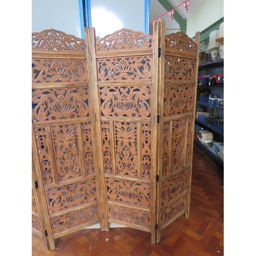 564 - Oak Four panel screen with pierced fretwork decoration. Each panel measures approx 72 x 20 inches. I... 