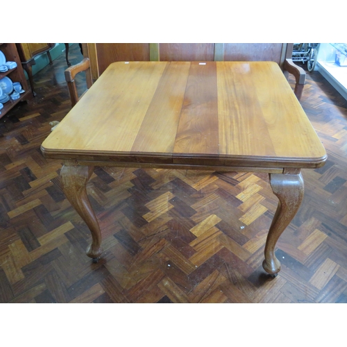 567 - Late 19th/Early 20th Century wind out Dining Table with single extension leaf. Raised on legs with o... 