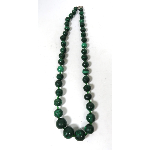 582 - 22 inch String of Graduated Banded Malachite beads. Quite heavy in good condition