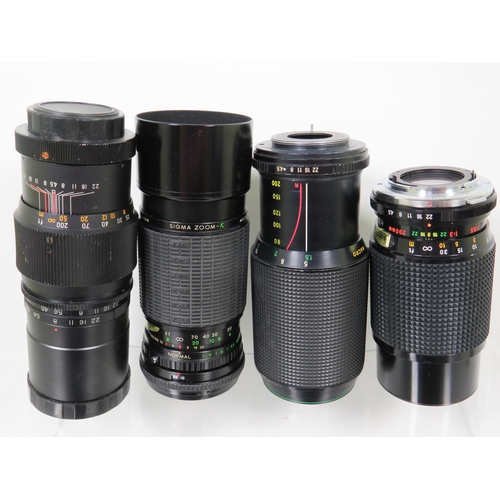 586 - Twelve assorted SLR camera lens by various makers to include Miranda and others.