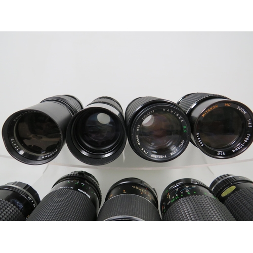 586 - Twelve assorted SLR camera lens by various makers to include Miranda and others.