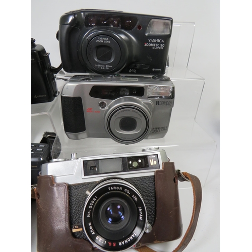 587 - Selection of Cameras by various makers to include Zenit, Yashica, Richoh . See photos.