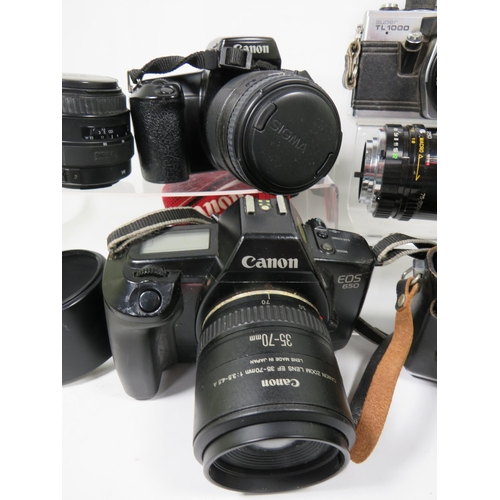 588 - Selection of SLR Cameras and Lens by Canon, Practika, Zenit