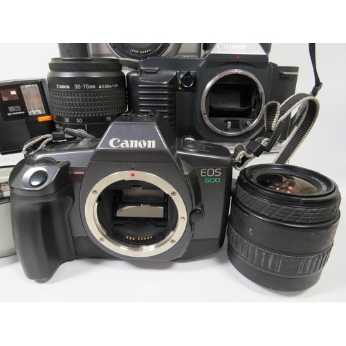 594 - Selection of Canon SLR Cameras and lens to include T70.  see photos