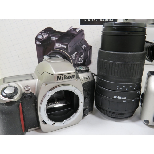 595 - Nikon Coolpix 3700 with original box and ancillaries plus other Nikon and Olympus Cameras. Sigma 100... 