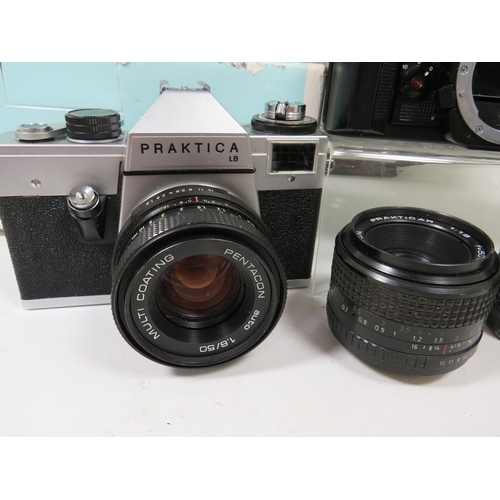 596 - Boxed Sigma Camera outfit to include a 20-80mm lens, instructions etc plus other cameras and lens by... 