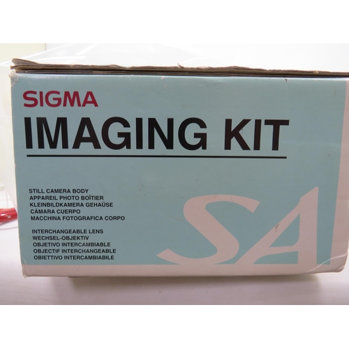 596 - Boxed Sigma Camera outfit to include a 20-80mm lens, instructions etc plus other cameras and lens by... 