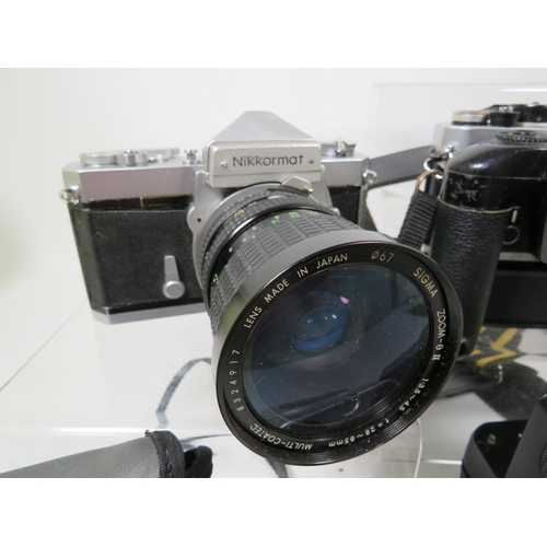 597 - Nikkormat SLR Camera with Sigma 28-85zoom lens,  Nikon Camera with lens and motorwind, two motorwind... 