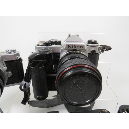 597 - Nikkormat SLR Camera with Sigma 28-85zoom lens,  Nikon Camera with lens and motorwind, two motorwind... 