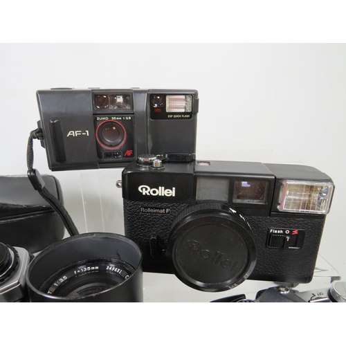 598 - Selection of Olympus and Rollei Cameras and lens to include OM10.  See photos.