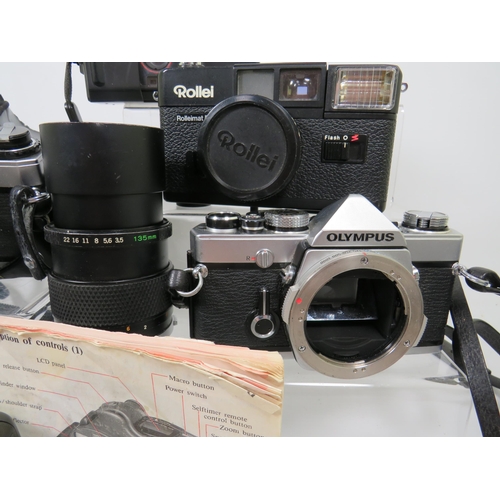 598 - Selection of Olympus and Rollei Cameras and lens to include OM10.  See photos.