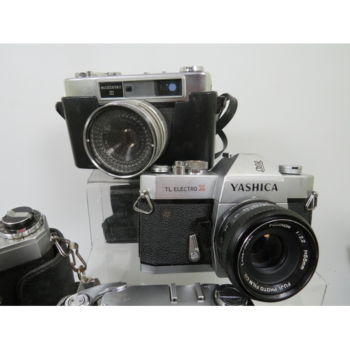 600 - Selection of Yashica Cameras plus Movie Cameras. See photos.