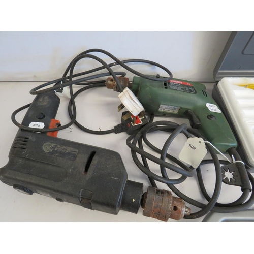 1133 - Two electric Drills, both working , solder gun. Selection of cased drills. See photos.