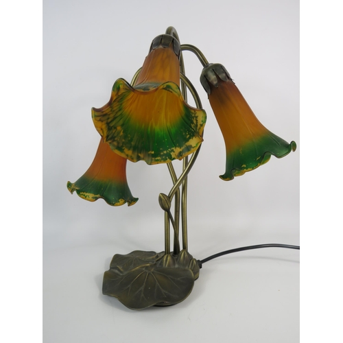 611 - Art Nouveau style lamp with three glass tulip shades.