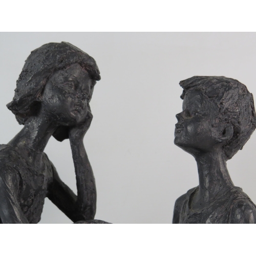 613 - Lightweight plastic sculpture of a boy and girl on a rock, 15