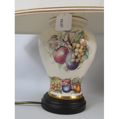 634 - Two Large table lamps decorated with fruit patterns.