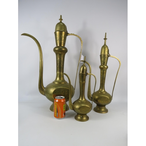 639 - Three large Indian brass teapots the tallest stands 25.5