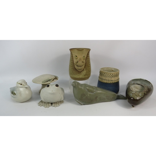 648 - Job lot of studio pottery and a soapstone Canadian seal sculpture.