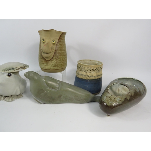 648 - Job lot of studio pottery and a soapstone Canadian seal sculpture.