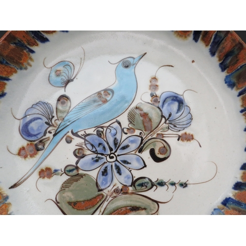 676 - Large Mexican pottery charger plate, 13.5