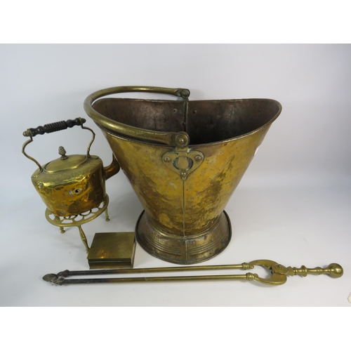 692 - Large brass coal bucket, kettle and trivot, fire tongs etc.