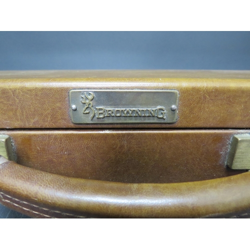 710 - A Browning leather gun case with keys.