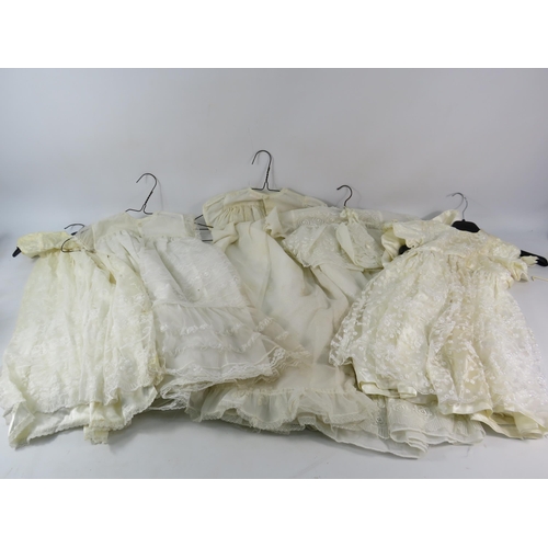 752 - Five vintage christening gowns.