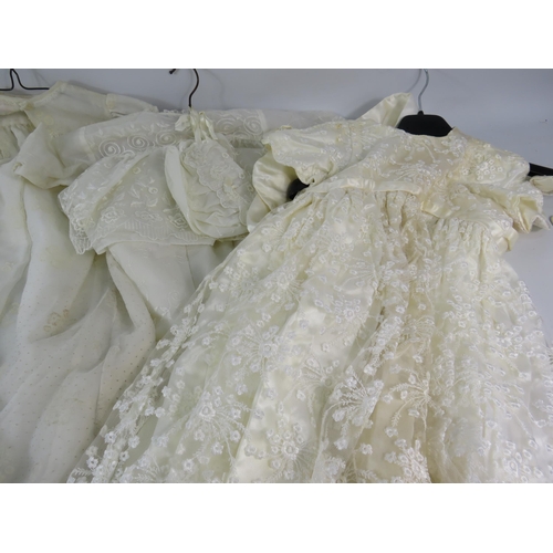 752 - Five vintage christening gowns.