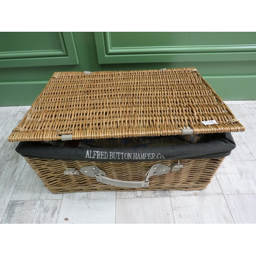 753 - A large Alfred button picnic basket and a selection of vintage costumes.