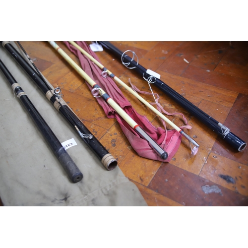 877 - Three Fishing rods with cases. See photos.