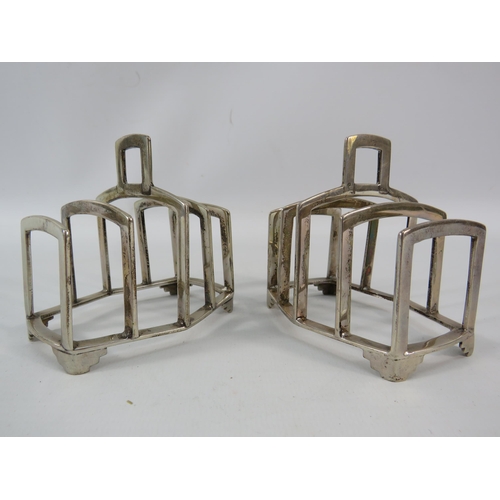 780 - Pair of Birmingham 1937 sterling silver toast racks, total combined weight 199 grams.