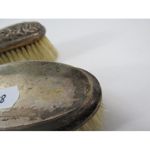 785 - Two sterling silver topped clothes brushes, Birmingham 1927 & 1898.