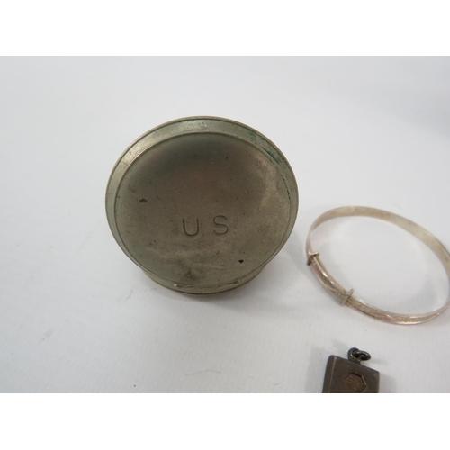 793 - White metal US compass, a sterling silver ingot and a sterling silver childs bracelet.